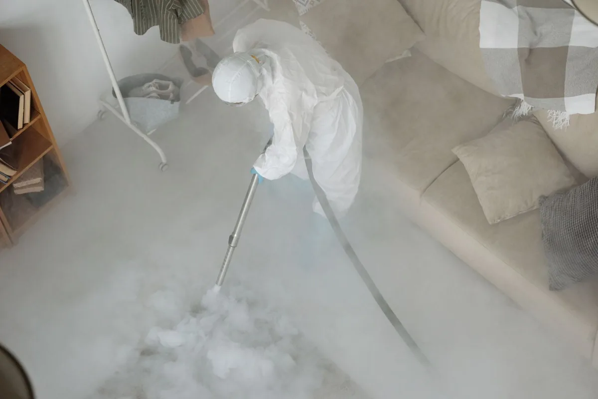 Biohazard cleanup technician in protective equipment, Alafaya, FL